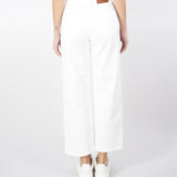 Jeans in cotone tinto con charm logato