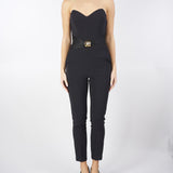 Tuta Nera in crêpe fluido con macro fiocco