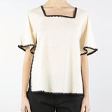Blusa in cotone con profili a contrasto