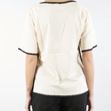 Blusa in cotone con profili a contrasto