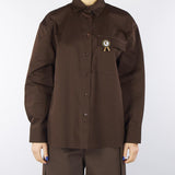 Camicia Moro in cotone con tasca e spilla