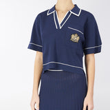 Maglia a polo con profili e stemma