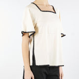 Blusa in cotone con profili a contrasto